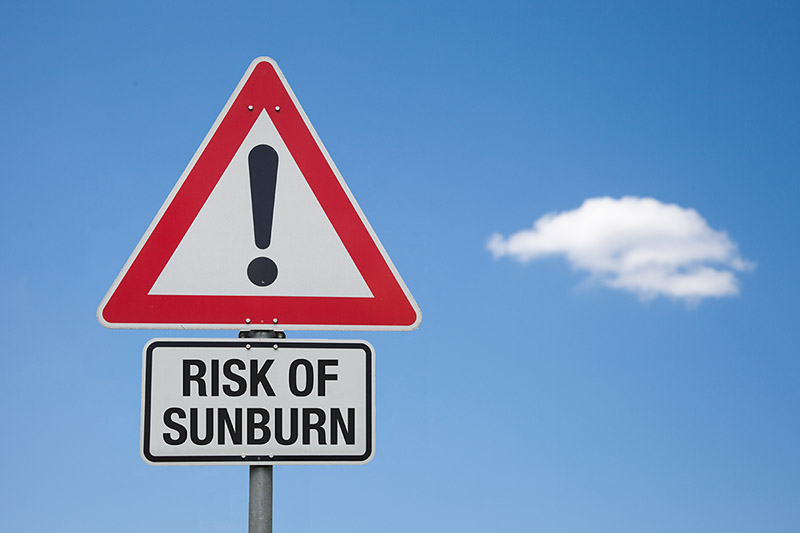 Sign showing risk of sunburn