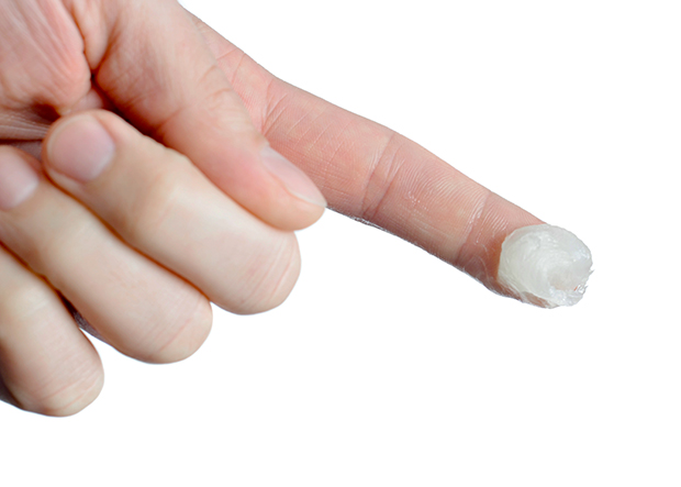 Finger with petroleum jelly on it, here are some amazing uses for petroleum jelly