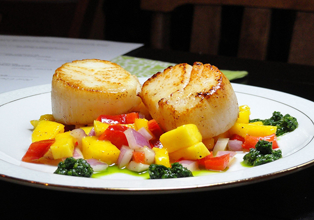 Scallops on a plate with mango relish, recipe from Chef Mary