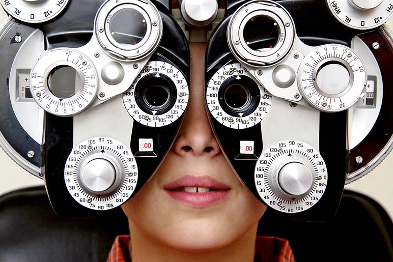 Young boy receiving an eye exam.