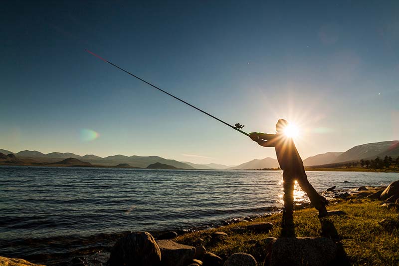 Man fishing and enjoying early retirement.