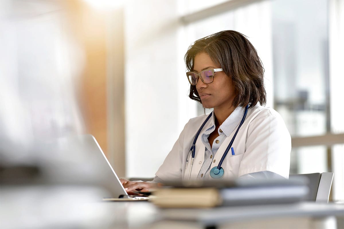 female doctor working on her laptop