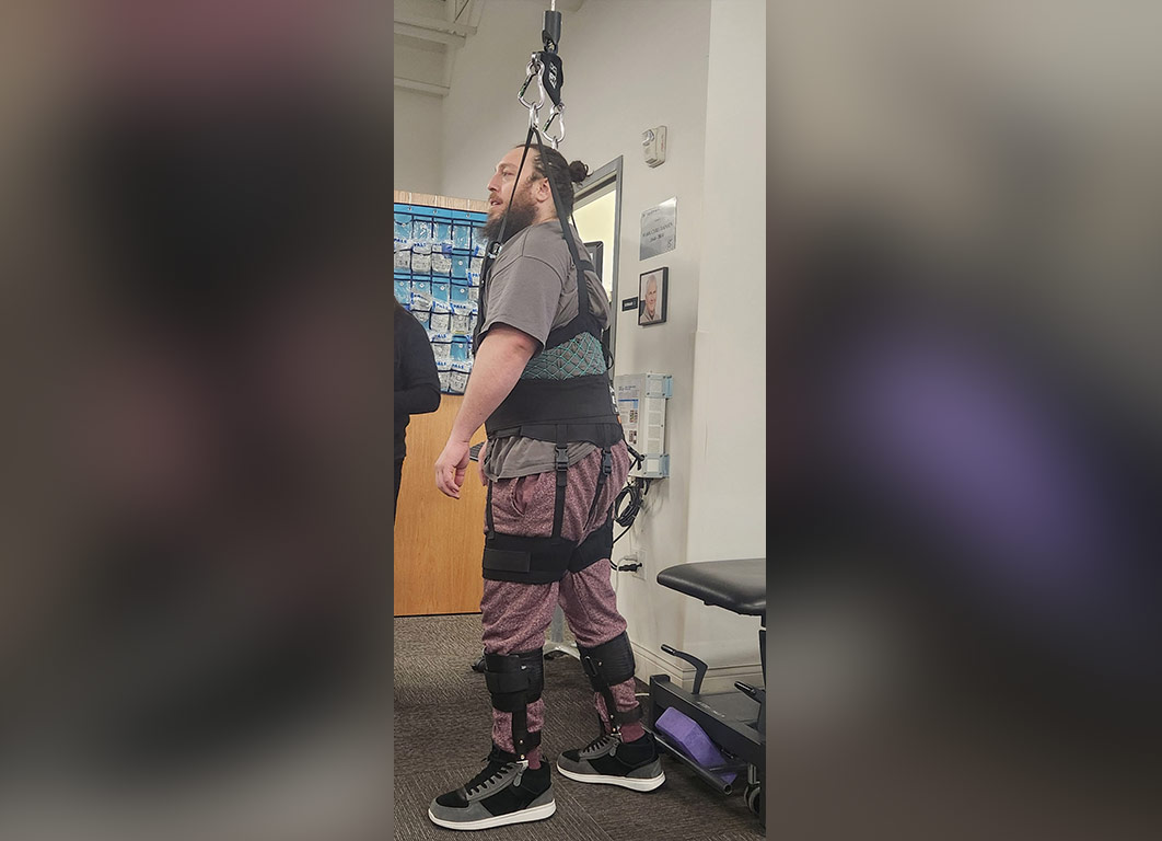 Martin learning how to walk in physical therapy.