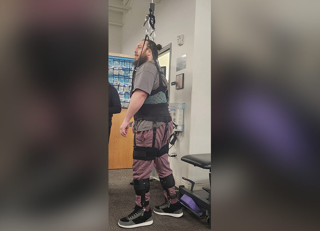 Martin learning how to walk in physical therapy.