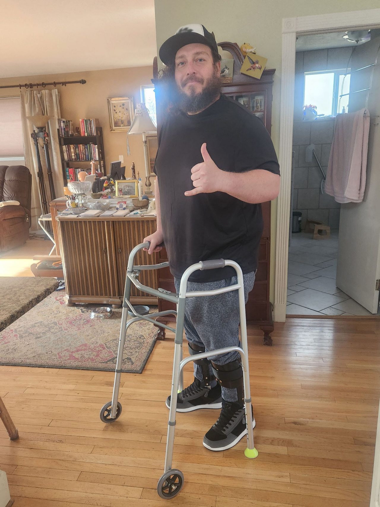 Martin standing with his walker.
