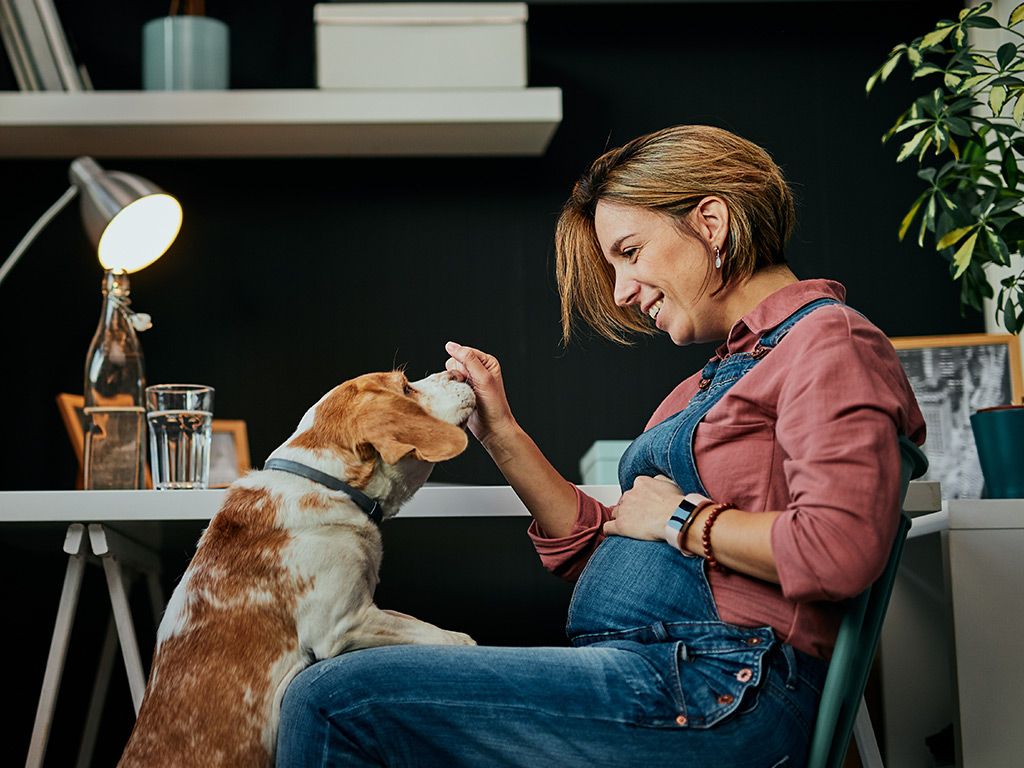 Woman playing with her dog